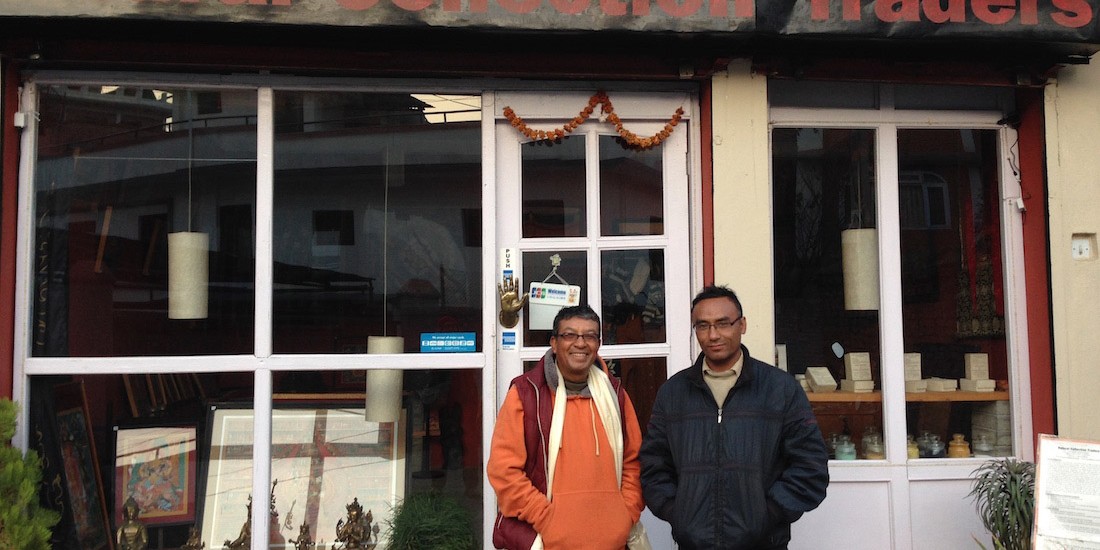 Sudarshan Suwal, left, and his assistant and brother-in-law Ramesh Ranjit pose in front of his studio in Patan