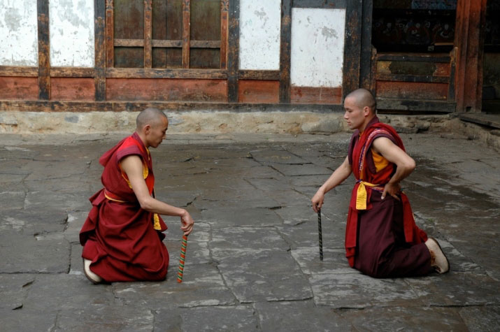 Two monks rehearsing “Jug Ging,” in which supernatural beings use wands to divine the presence of evil, Tamzhing Monastery, Bhutan, 2005. From Core of Culture. Is it a “stick dance?”