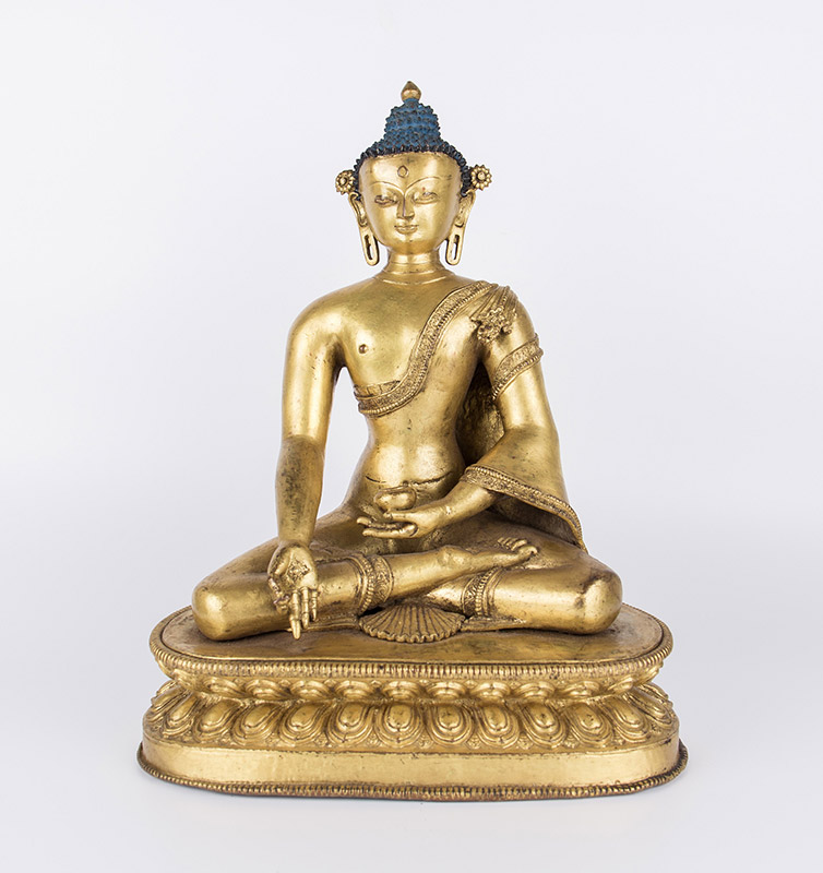 Medicine Buddha. c. 14th century, Tibet or Nepal. Gilt copper alloy, 34 cm